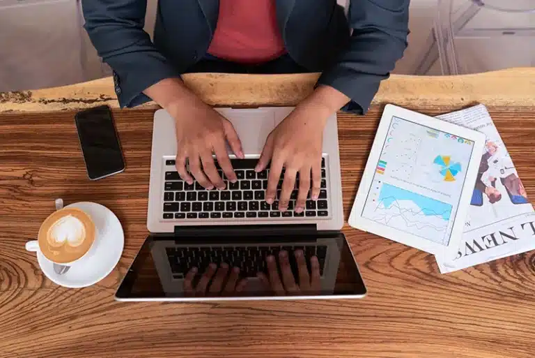 Blogger analyzing keyword data and SEO metrics to choose high-ranking keywords for blog posts in 2025