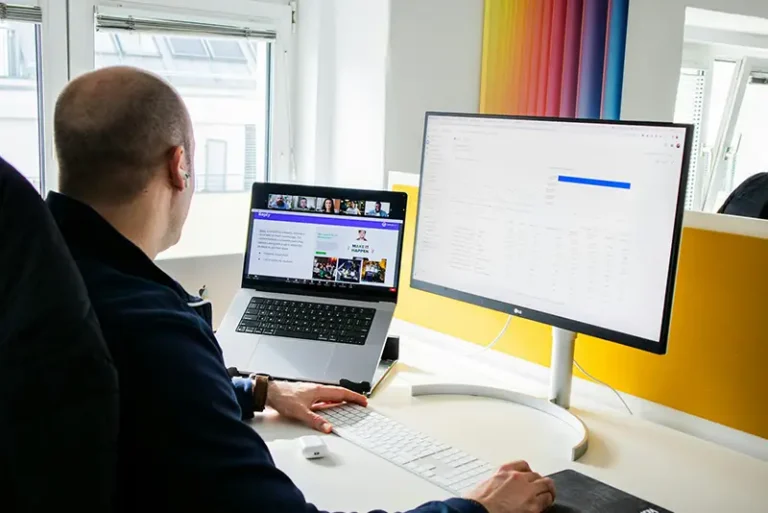 Modern web design concept showing designers working on layouts and color schemes for a new website.