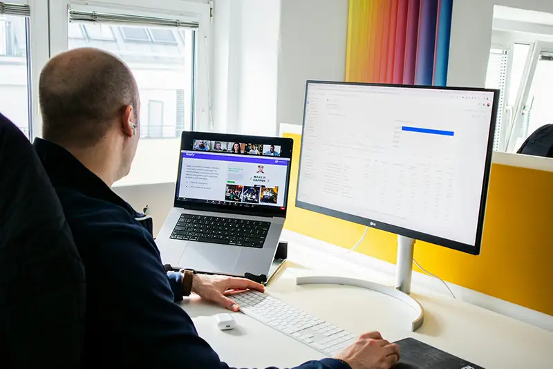 Modern web design concept showing designers working on layouts and color schemes for a new website.