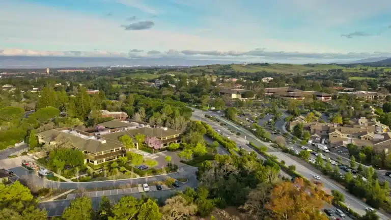 Mission Hill, California neighborhood with hillside homes, tree-lined streets, and city views under a clear sky.