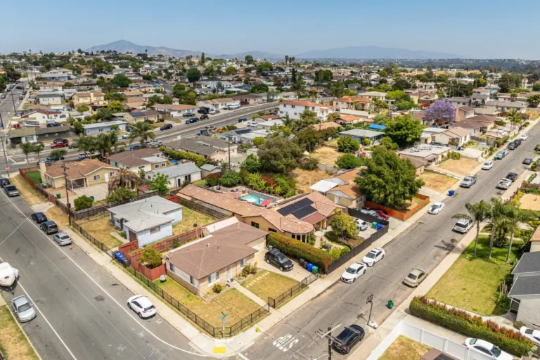 Residential aerial view of Paradise Hills neighborhood featuring homes, streets, and surrounding community.