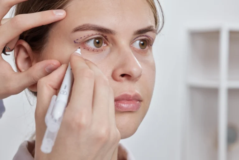 A woman undergoing an eye examination with an eye doctor in a clinical setting.